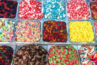 assorted candies in plastic containers