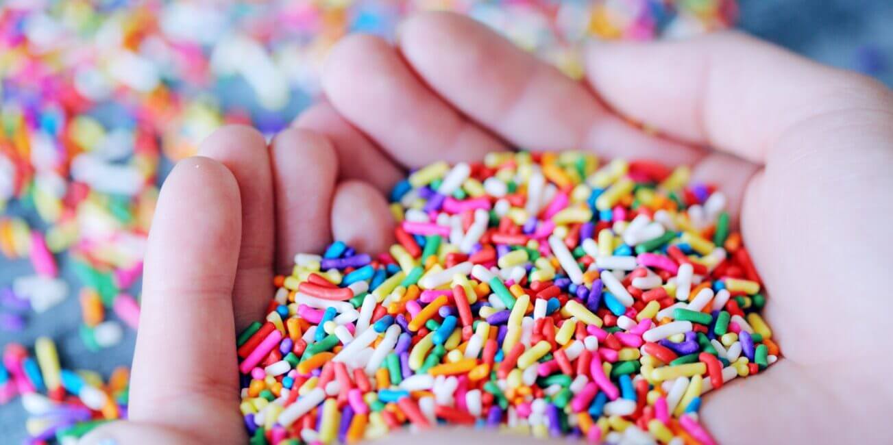 person holding sprinkles