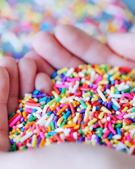 person holding sprinkles