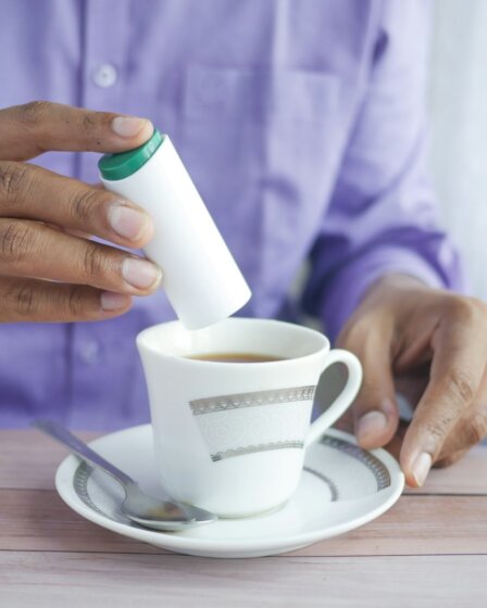 person holding white ceramic mug